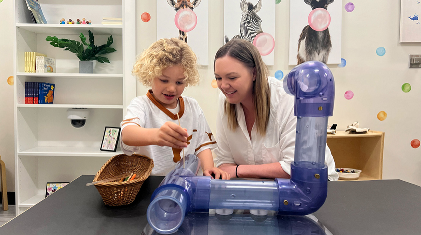 Dr. Nicole Perry working with a toddler